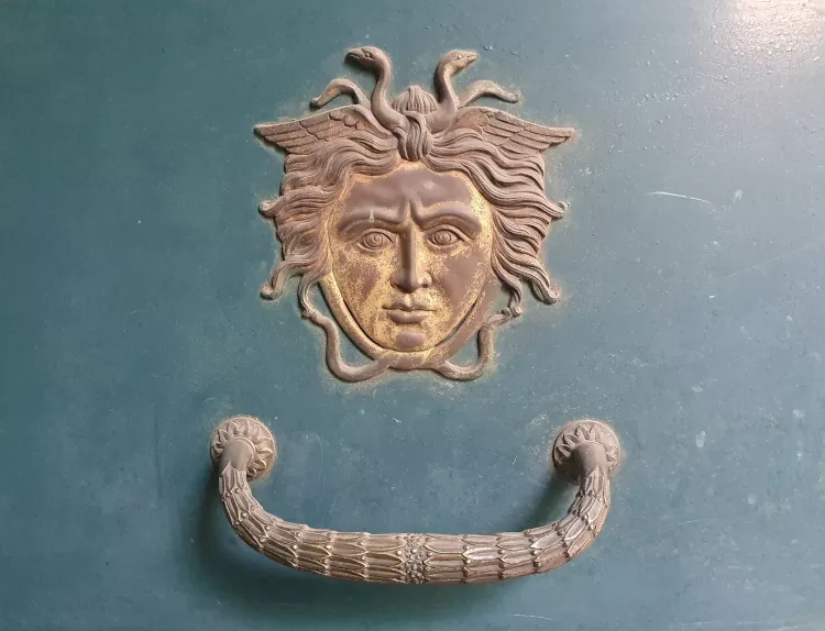 A popular lucky charm in Sicily: the Medusa head on a door is said to keep away all evil